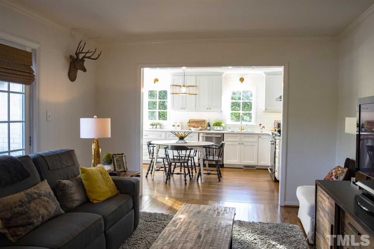 2324 Ridge Road Raleigh, NC 27612 - Photo 14 of 25 a living room with furniture wooden floor and a table