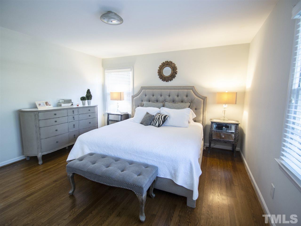 2324 Ridge Road Raleigh, NC 27612 - Photo 16 of 25 a bed room with a bed and a window