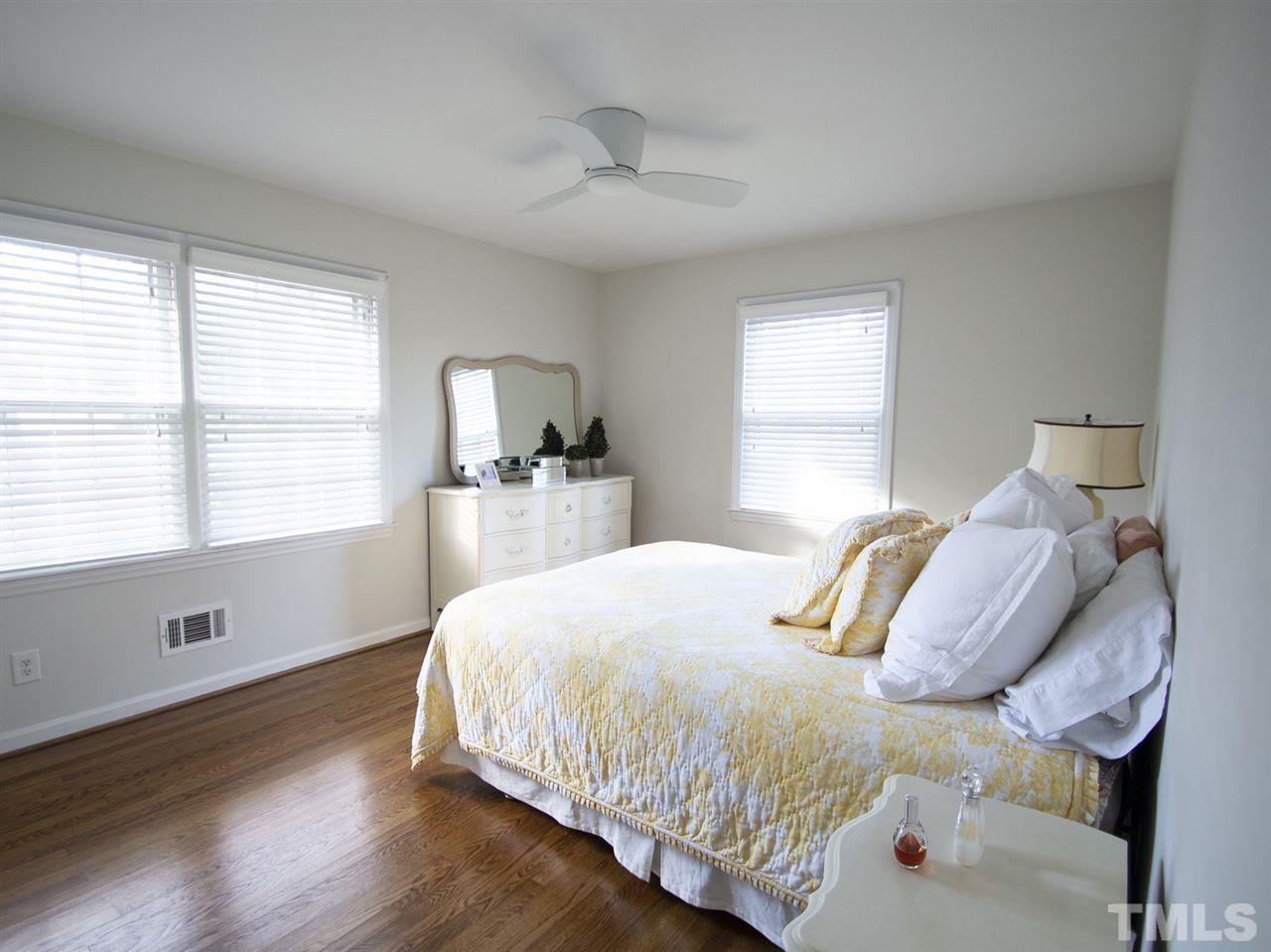 2324 Ridge Road Raleigh, NC 27612 - Photo 20 of 25 a bedroom with a bed and window