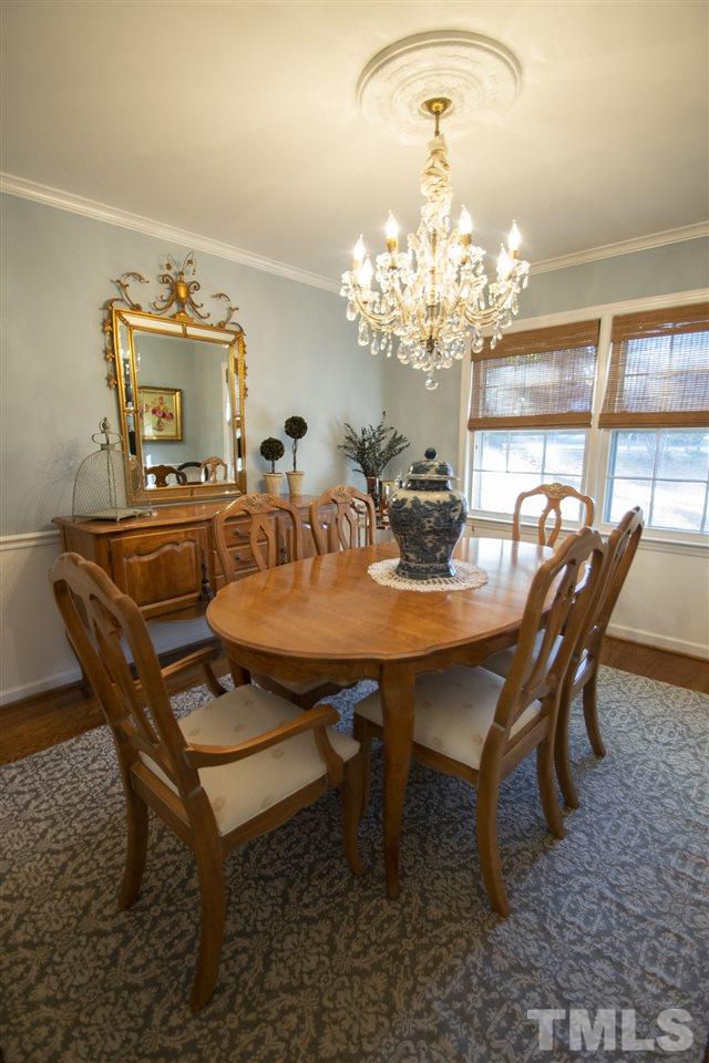 2324 Ridge Road Raleigh, NC 27612 - Photo 5 of 25 a view of a dining room with furniture and a chandelier