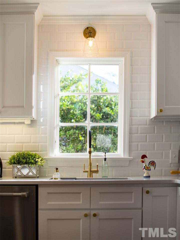 2324 Ridge Road Raleigh, NC 27612 - Photo 7 of 25 a kitchen with a sink and a window
