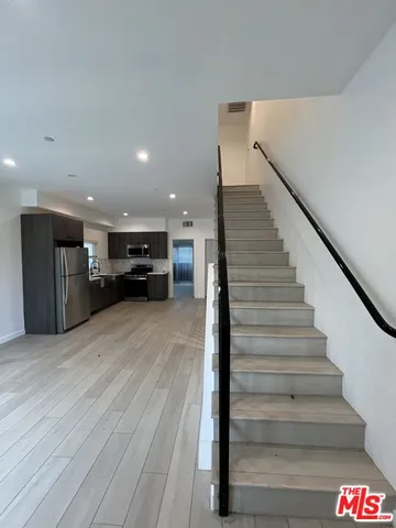 a view of entryway and kitchen