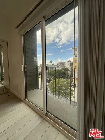 a view of a glass door and porch