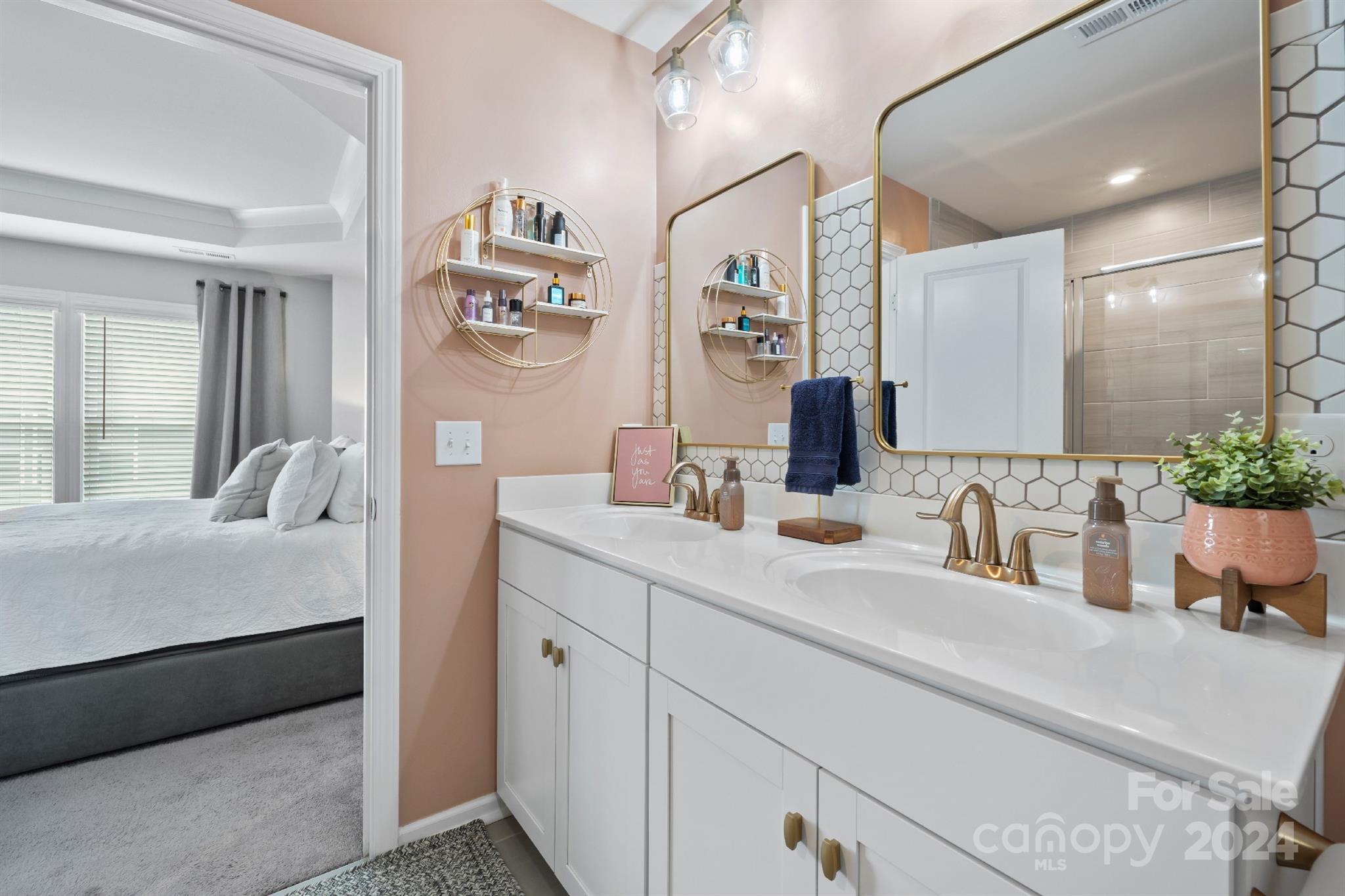 829 Canoe Song Road Fort Mill, SC 29708 - Photo 21 of 38 a bathroom with a double vanity sink and a mirror