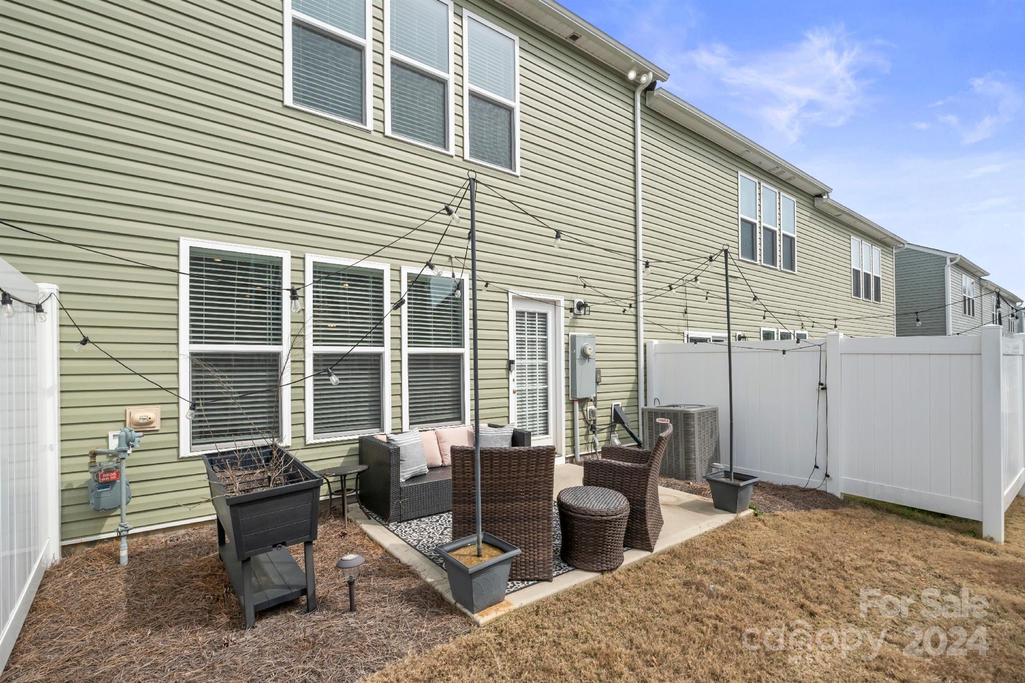 829 Canoe Song Road Fort Mill, SC 29708 - Photo 33 of 38 a view of a patio with couple of chairs and potted plants