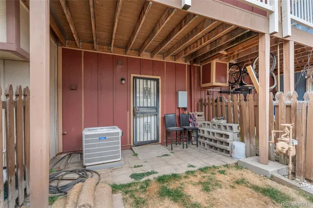 a view of front door with chair and couch