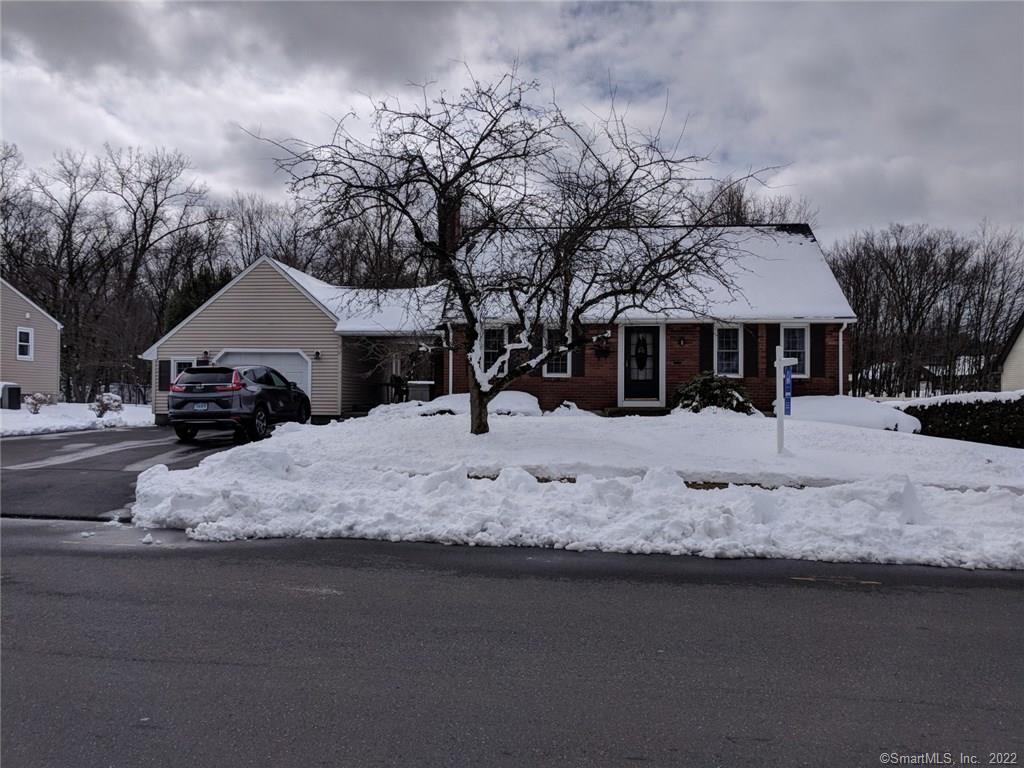 55 Ridge Road Enfield, CT 06082 - Photo 1 of 1 a front view of a house with a yard covered in snow