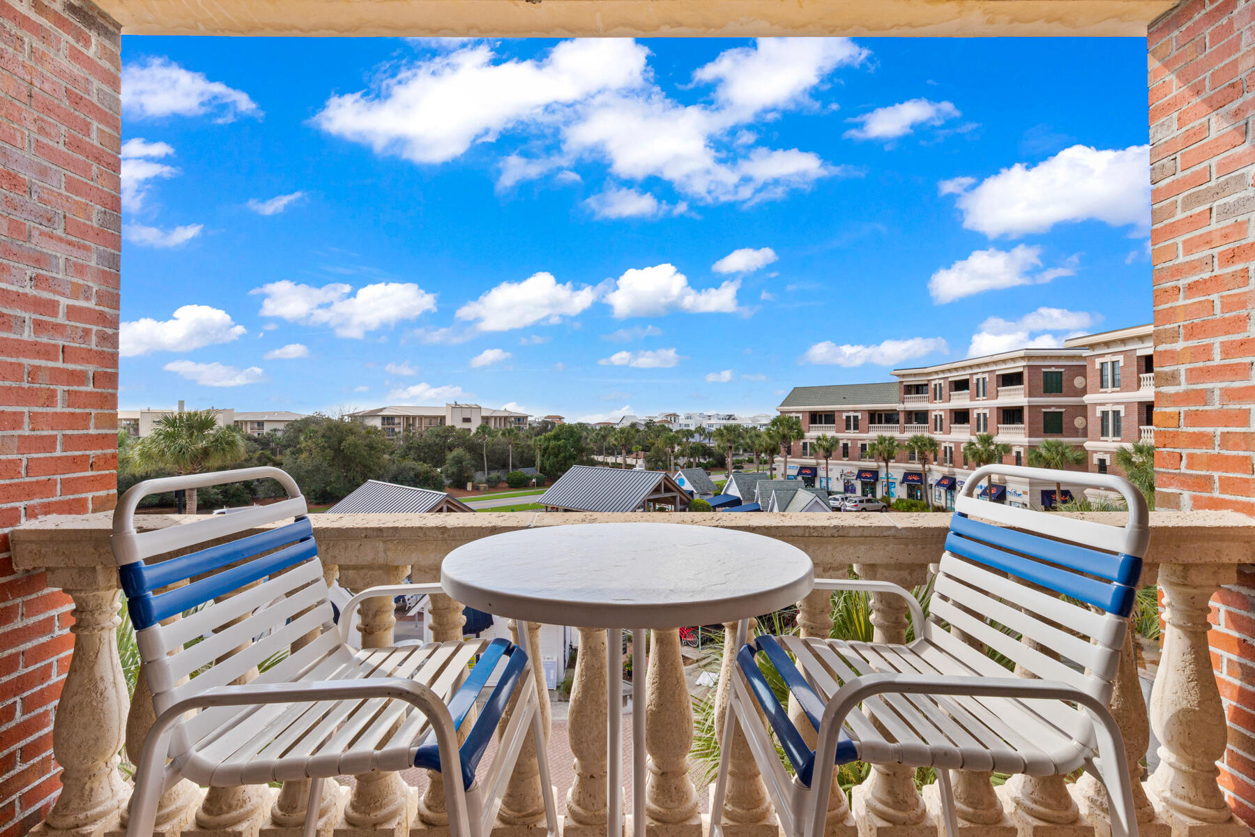 10343 East County Highway 30A, Unit 312D Inlet Beach, FL 32413 - Photo 18 of 19 a view of a chairs and table in a patio
