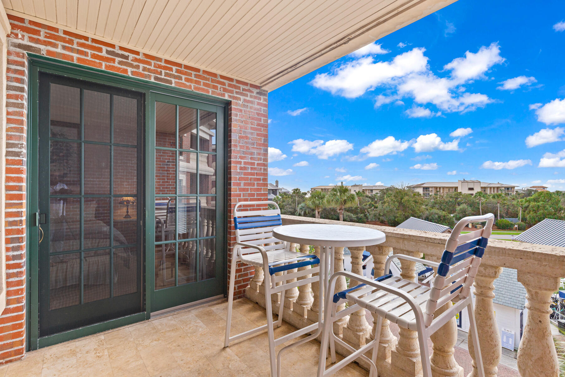 10343 East County Highway 30A, Unit 312D Inlet Beach, FL 32413 - Photo 19 of 19 a view of a patio with a table and chairs