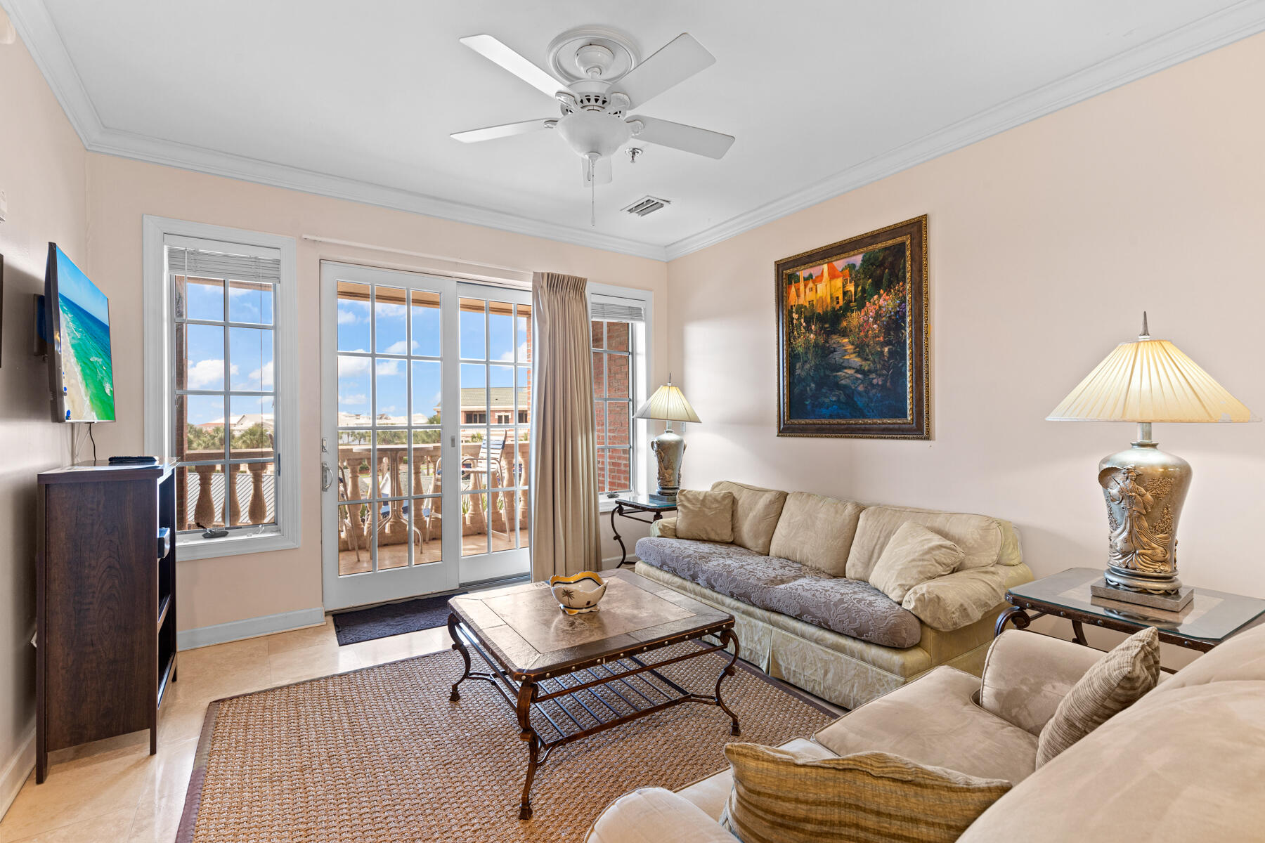 10343 East County Highway 30A, Unit 312D Inlet Beach, FL 32413 - Photo 3 of 19 a living room with furniture a flat screen tv and a window