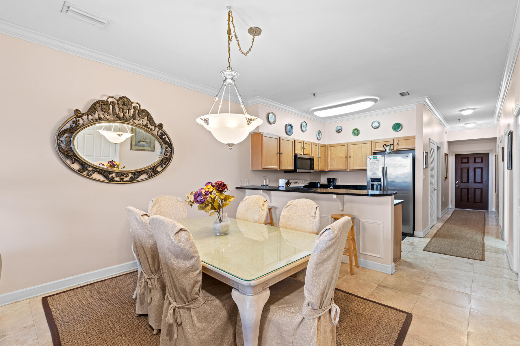 10343 East County Highway 30A, Unit 312D Inlet Beach, FL 32413 - Photo 5 of 19 a kitchen with a table and chairs in it