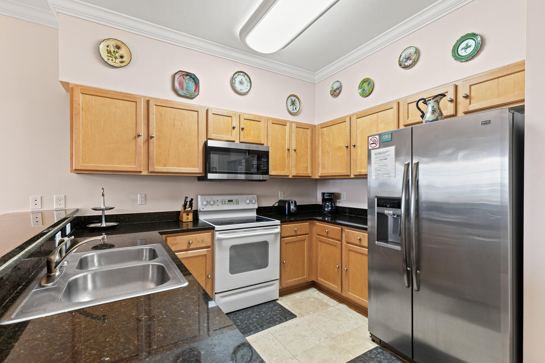 10343 East County Highway 30A, Unit 312D Inlet Beach, FL 32413 - Photo 8 of 19 a kitchen with stainless steel appliances granite countertop a sink a stove and a refrigerator