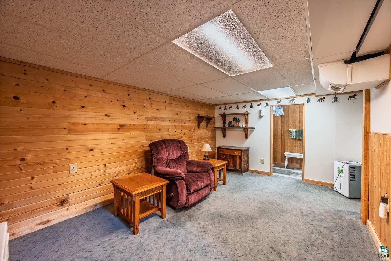 319 Michigan Avenue West Gilbert, MN 55741 - Photo 19 of 48 Finished interior space featuring wood paneling, paneled drop ceiling, and carpeted flooring
