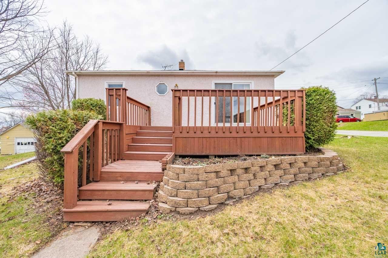319 Michigan Avenue West Gilbert, MN 55741 - Photo 29 of 48 Expansive wooden deck with coordinating railings and multi-level stairs