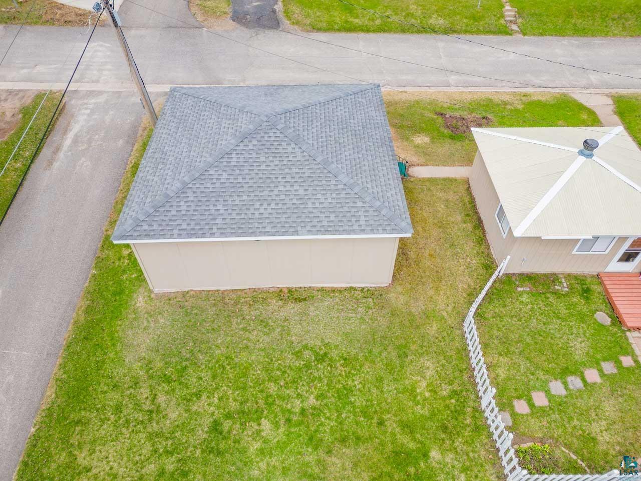 319 Michigan Avenue West Gilbert, MN 55741 - Photo 43 of 48 Aerial perspective showcasing two properties with pitched roofs and surrounding green lawns