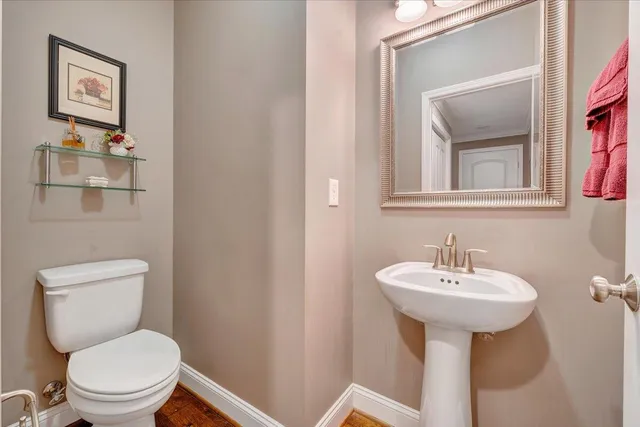 a living room with furniture gym equipment and a ceiling fan