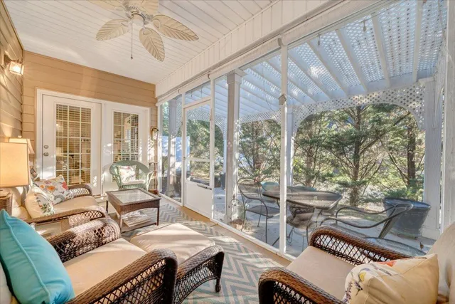 a front view of a house with a garden and plants