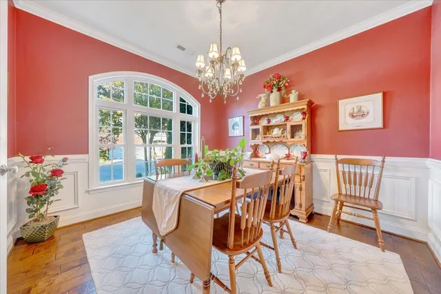 a kitchen with stainless steel appliances kitchen island granite countertop a stove and a refrigerator