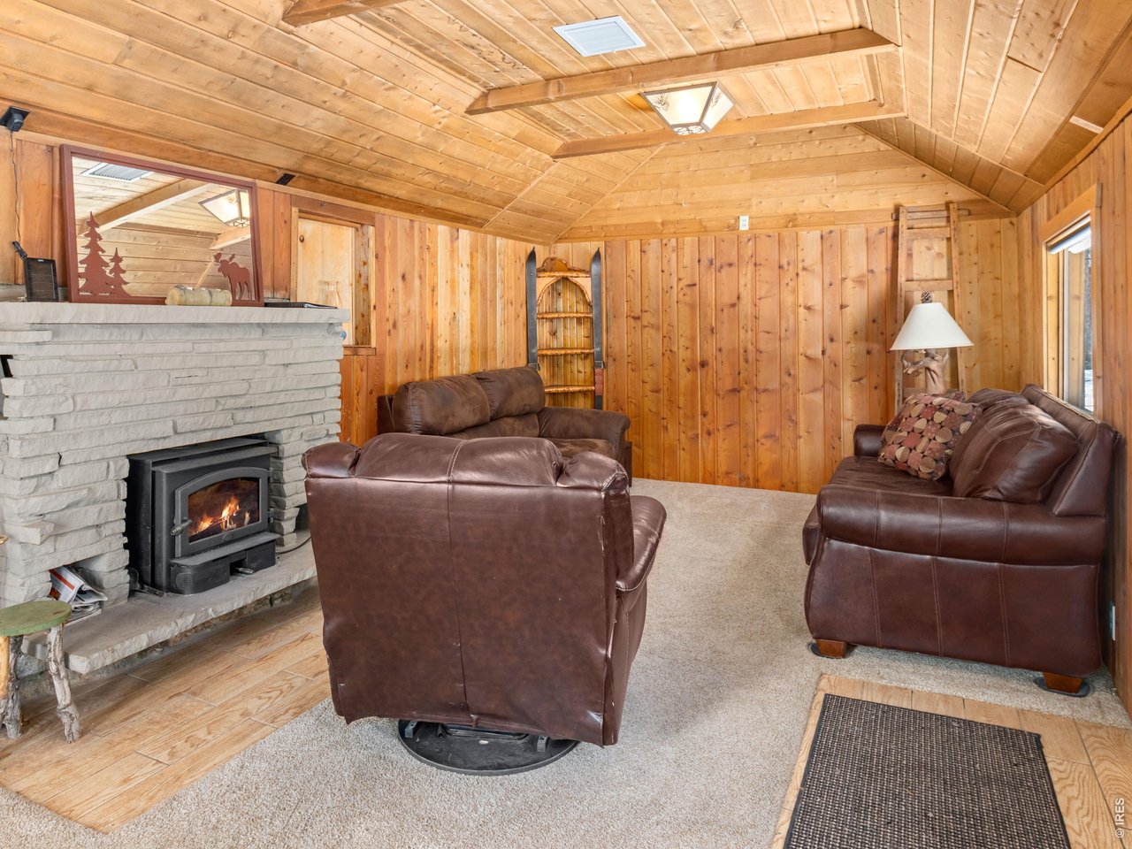3143 Riverside Drive Lyons, CO 80540 - Photo 14 of 24 a living room with furniture and a fireplace