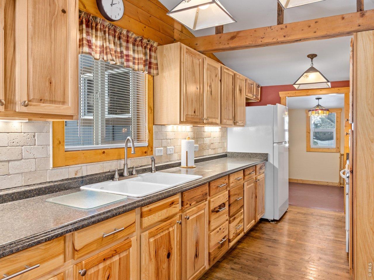 3143 Riverside Drive Lyons, CO 80540 - Photo 15 of 24 a kitchen with stainless steel appliances granite countertop a sink and a cabinets