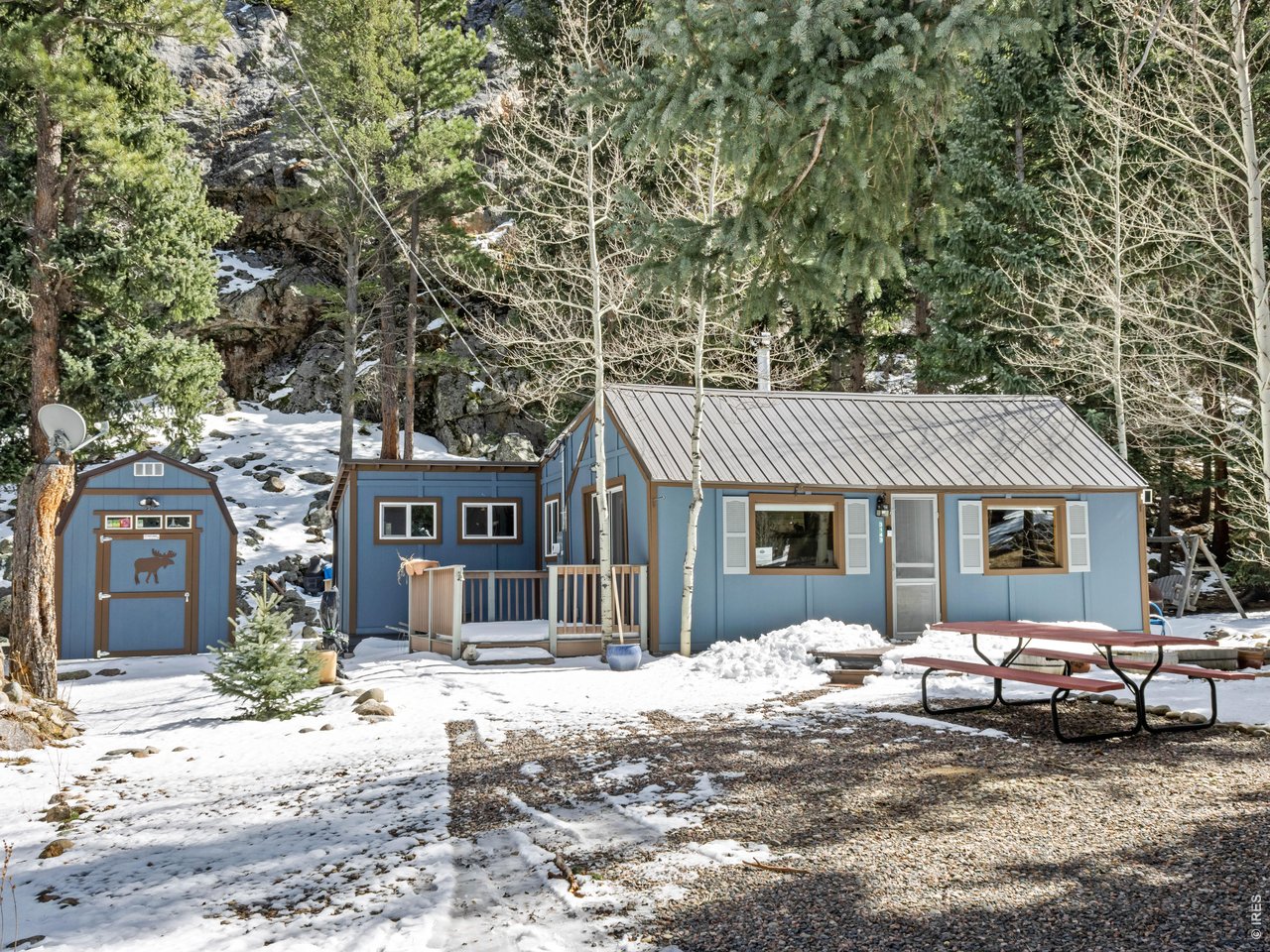 3143 Riverside Drive Lyons, CO 80540 - Photo 20 of 24 a view of a house with a yard covered in snow