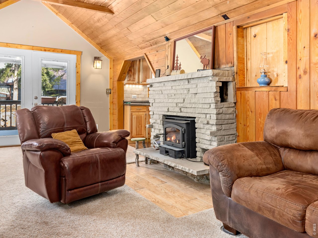 3143 Riverside Drive Lyons, CO 80540 - Photo 5 of 24 a living room with furniture and a fireplace