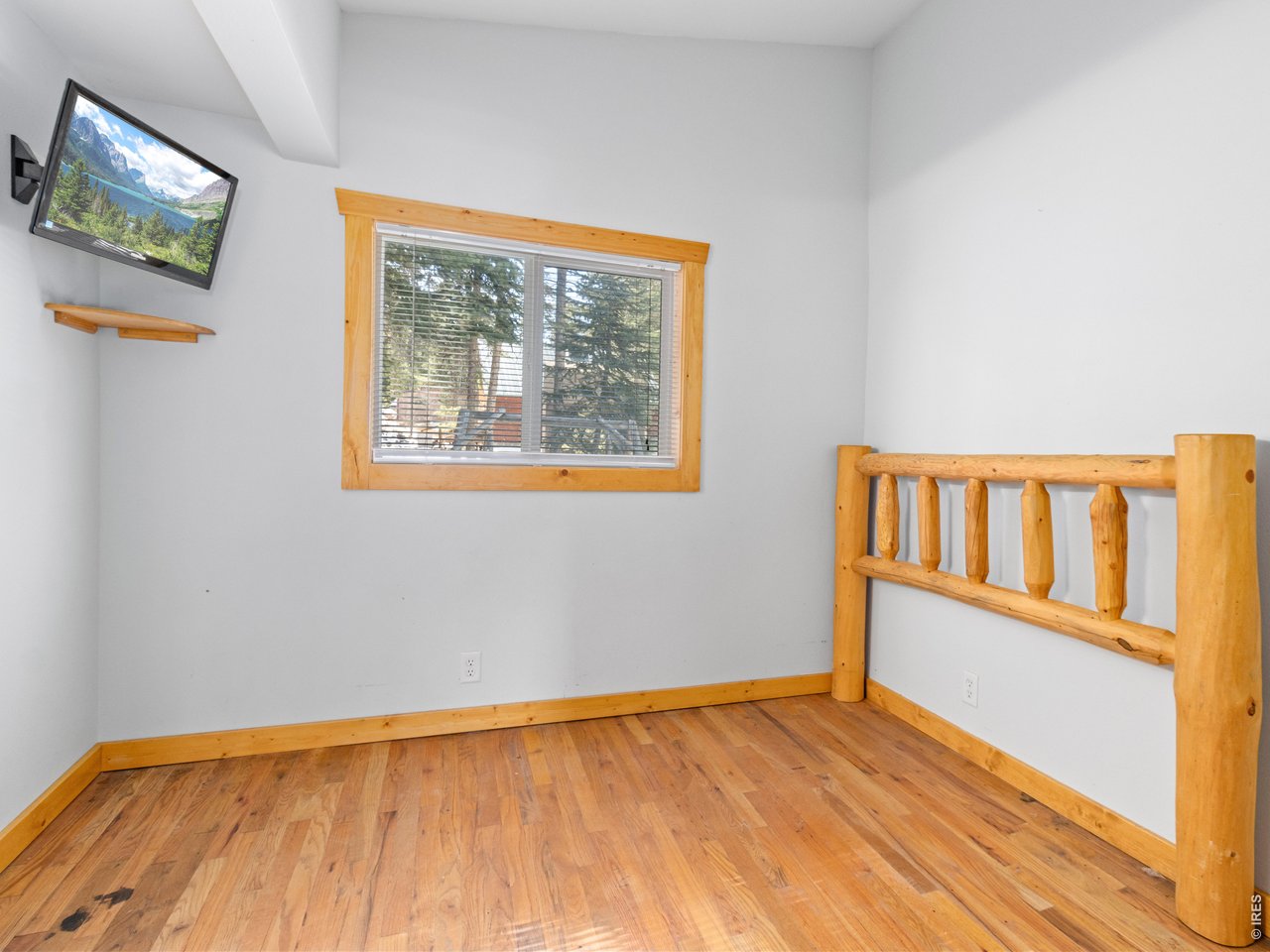 3143 Riverside Drive Lyons, CO 80540 - Photo 8 of 24 a view of an empty room with wooden floor and a window