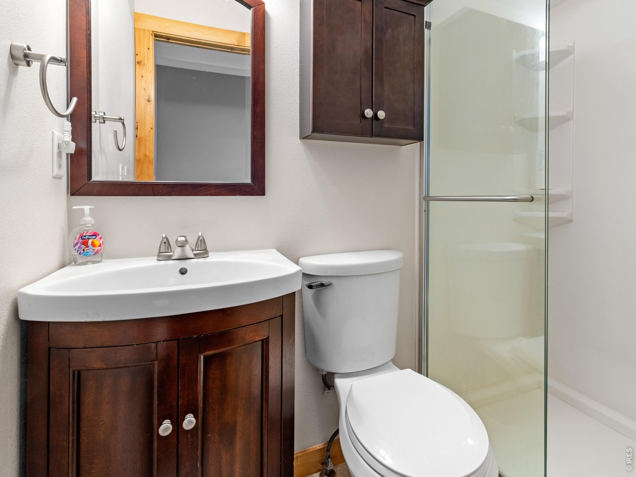 3143 Riverside Drive Lyons, CO 80540 - Photo 9 of 24 a bathroom with a sink a toilet and mirror