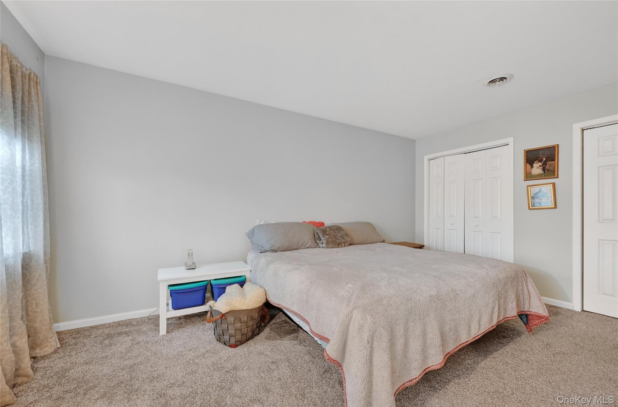 89 James Wilkinson Road Rock Tavern, NY 12575 - Photo 11 of 11 a bedroom with a bed and lamp