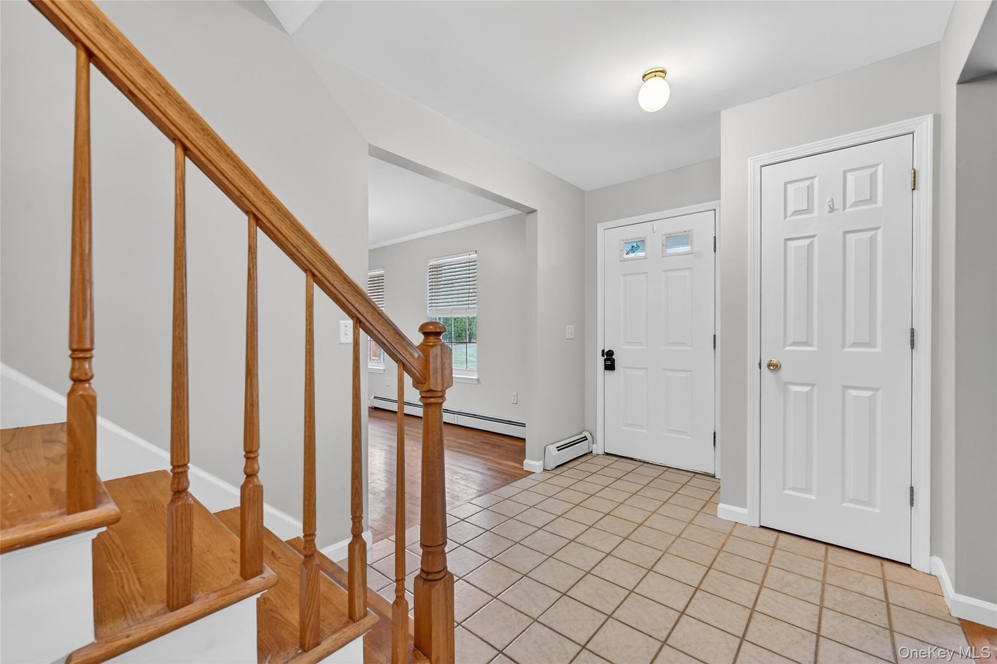 89 James Wilkinson Road Rock Tavern, NY 12575 - Photo 2 of 11 a view of an entryway with wooden floor and stairs