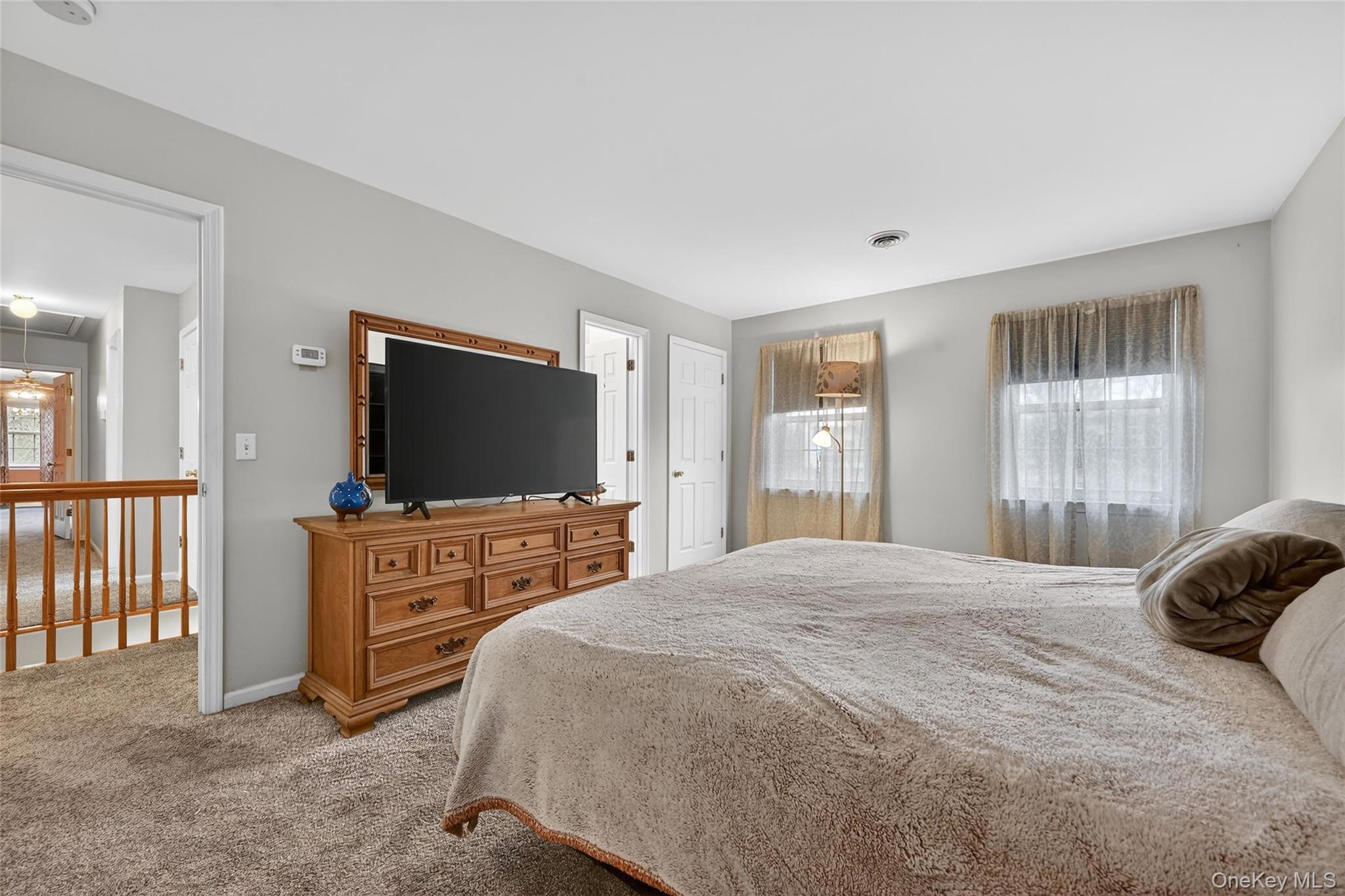 89 James Wilkinson Road Rock Tavern, NY 12575 - Photo 9 of 11 a bedroom with a bed and a flat screen tv