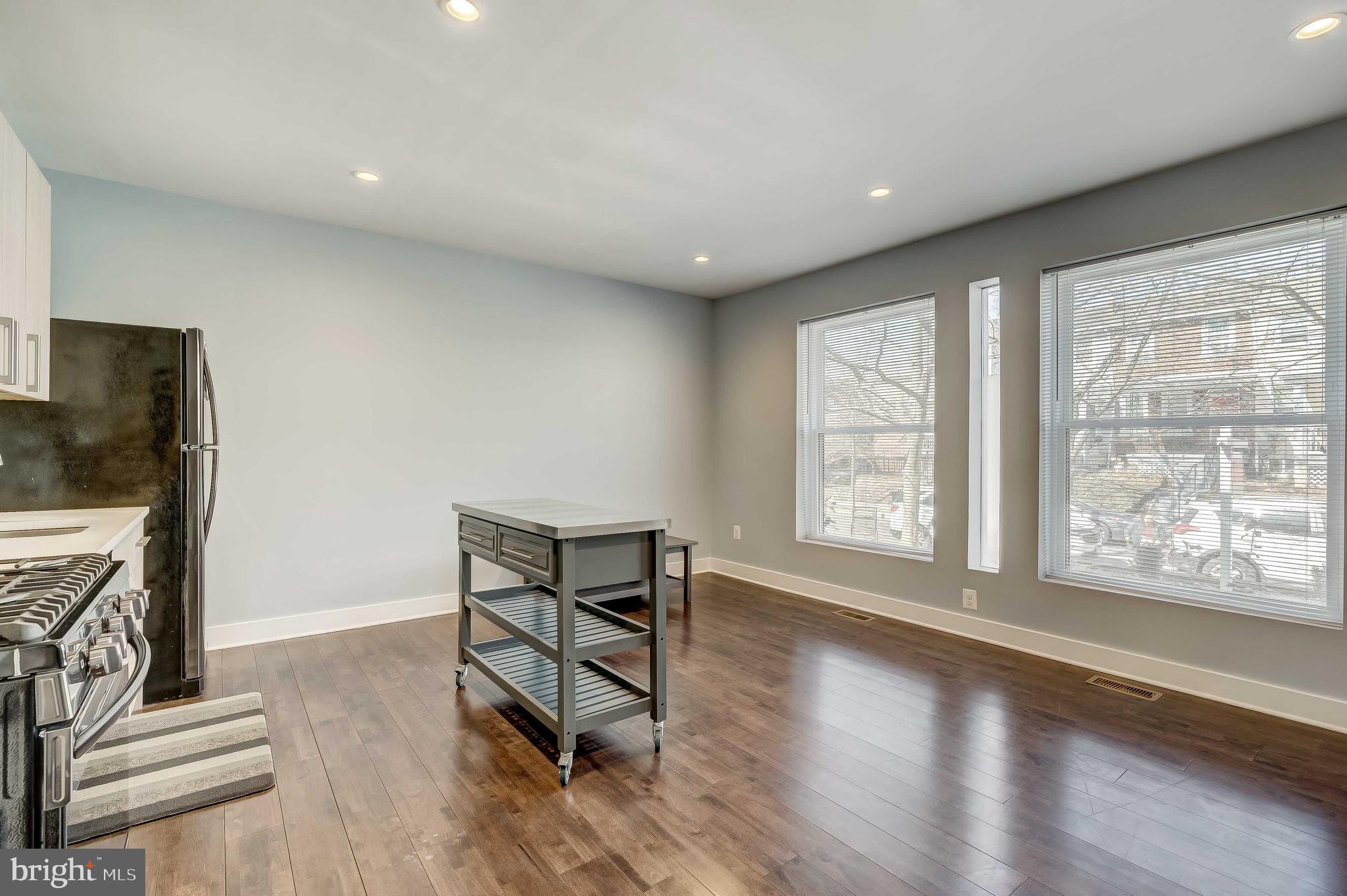 1605 F Street Northeast, Unit 2 Washington, DC 20002 - Photo 11 of 29 a view of livingroom with furniture flat screen tv and staircase