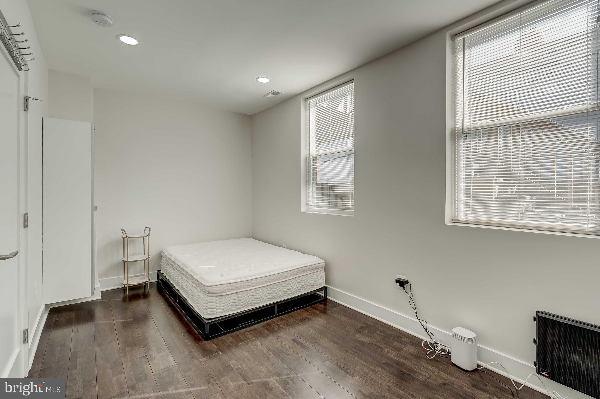 1605 F Street Northeast, Unit 2 Washington, DC 20002 - Photo 12 of 29 a room with a bed and a window
