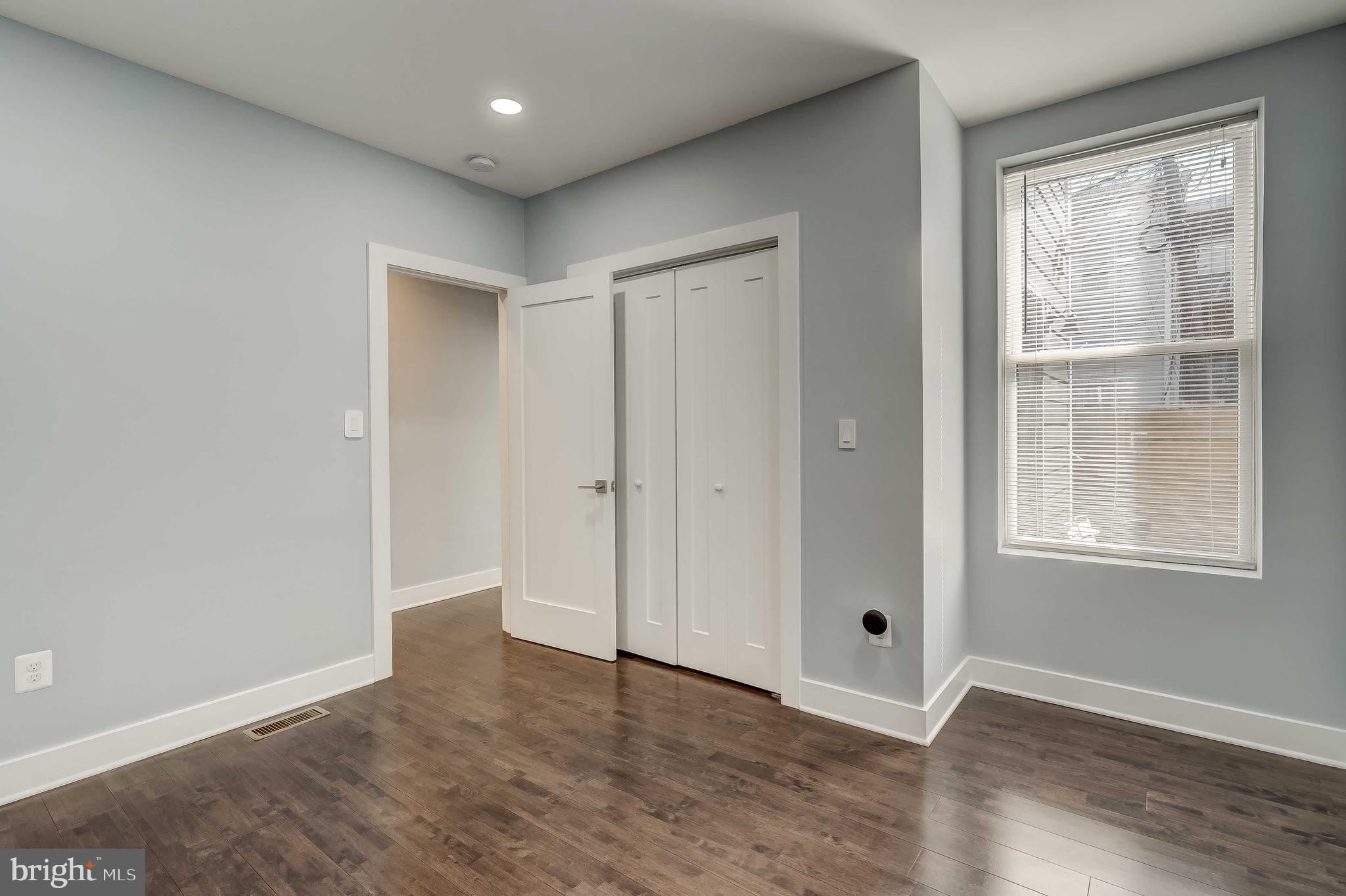 1605 F Street Northeast, Unit 2 Washington, DC 20002 - Photo 14 of 29 an empty room with wooden floor and windows