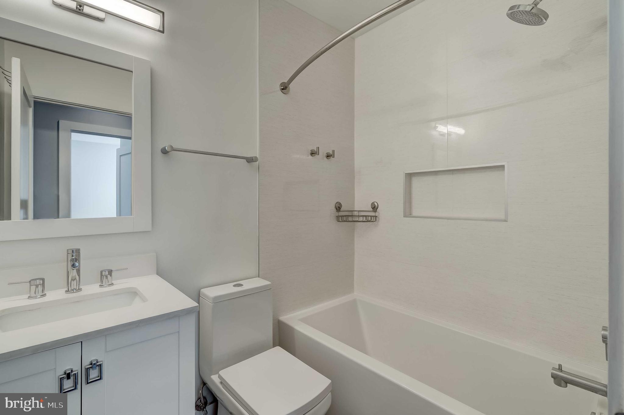 1605 F Street Northeast, Unit 2 Washington, DC 20002 - Photo 18 of 29 a bathroom with a sink toilet and shower