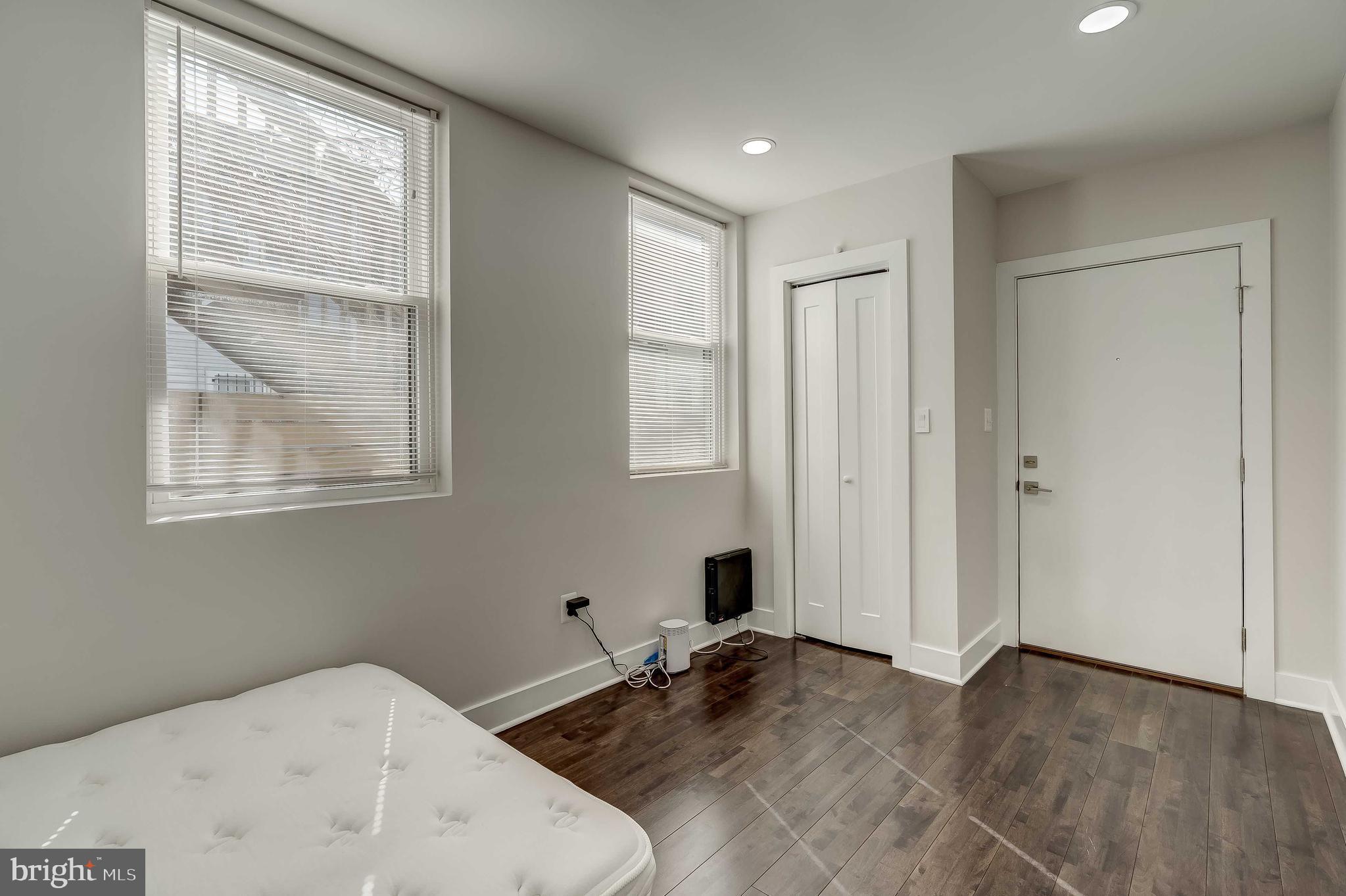 1605 F Street Northeast, Unit 2 Washington, DC 20002 - Photo 21 of 29 a bedroom with a bed and a window