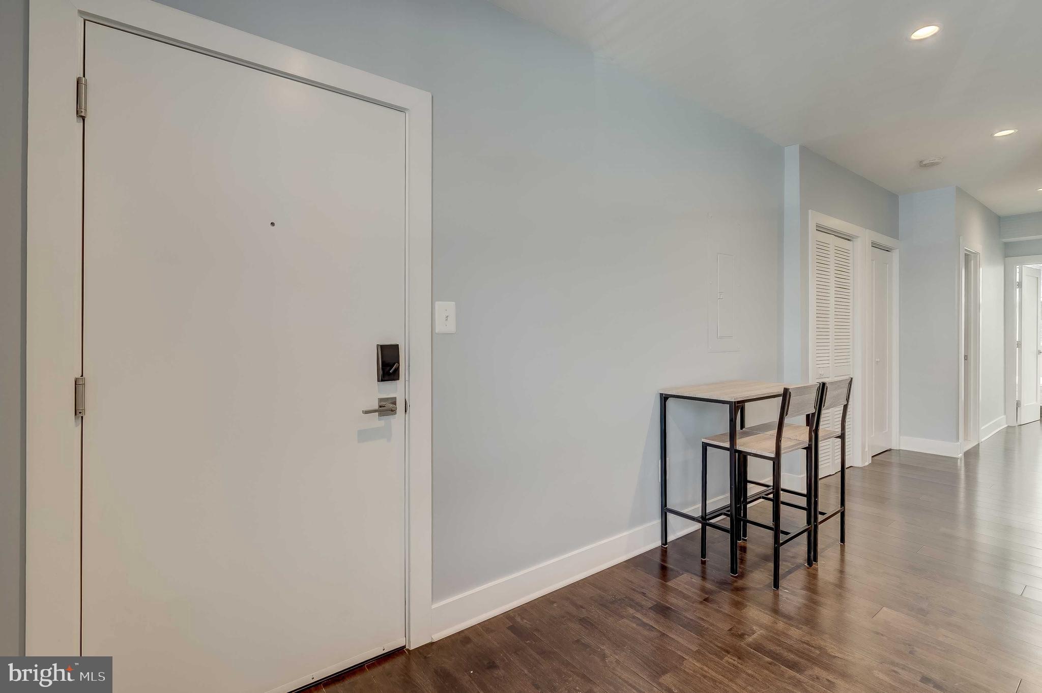 1605 F Street Northeast, Unit 2 Washington, DC 20002 - Photo 3 of 29 a view of a room with wooden floor and a hallway