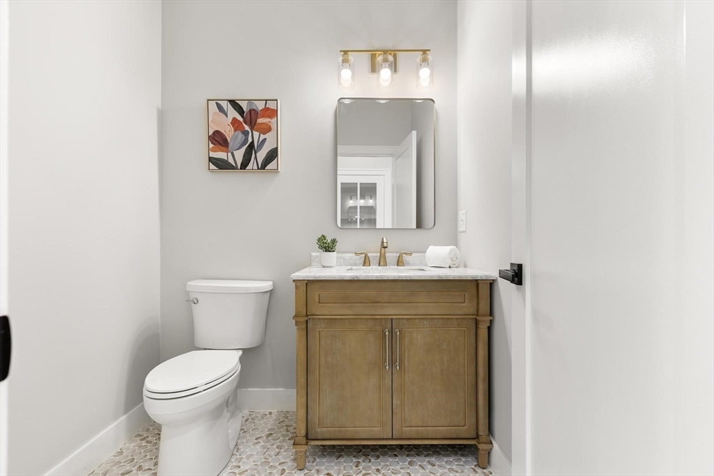 29 Beaverbrook Road Burlington, MA 01803 - Photo 17 of 42 a bathroom with a toilet sink and mirror