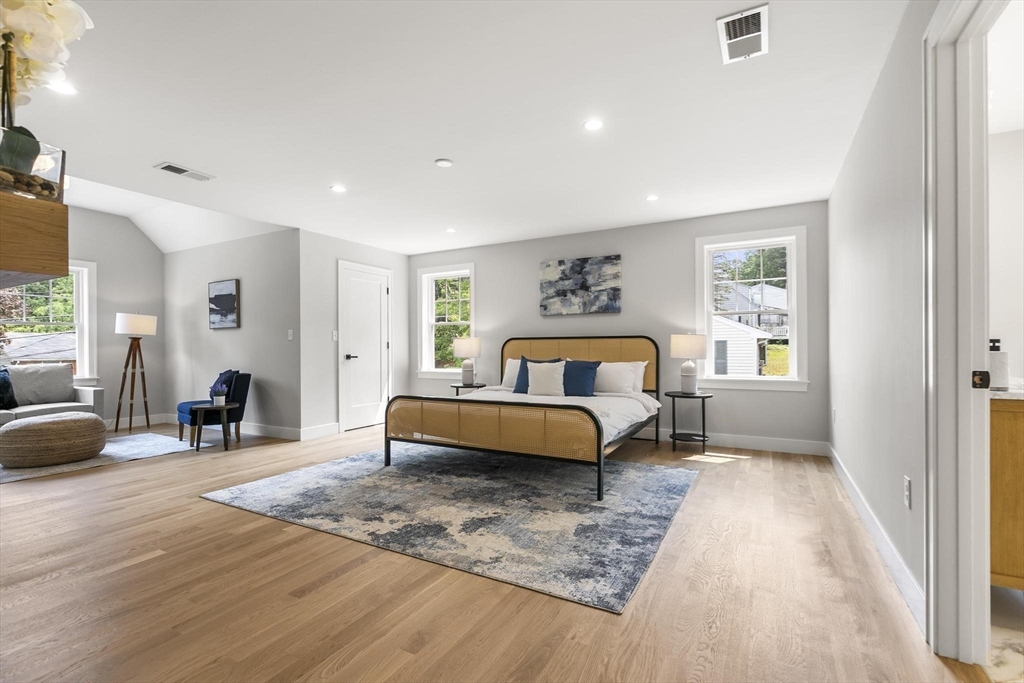 29 Beaverbrook Road Burlington, MA 01803 - Photo 19 of 42 a bedroom with a bed and wooden floor