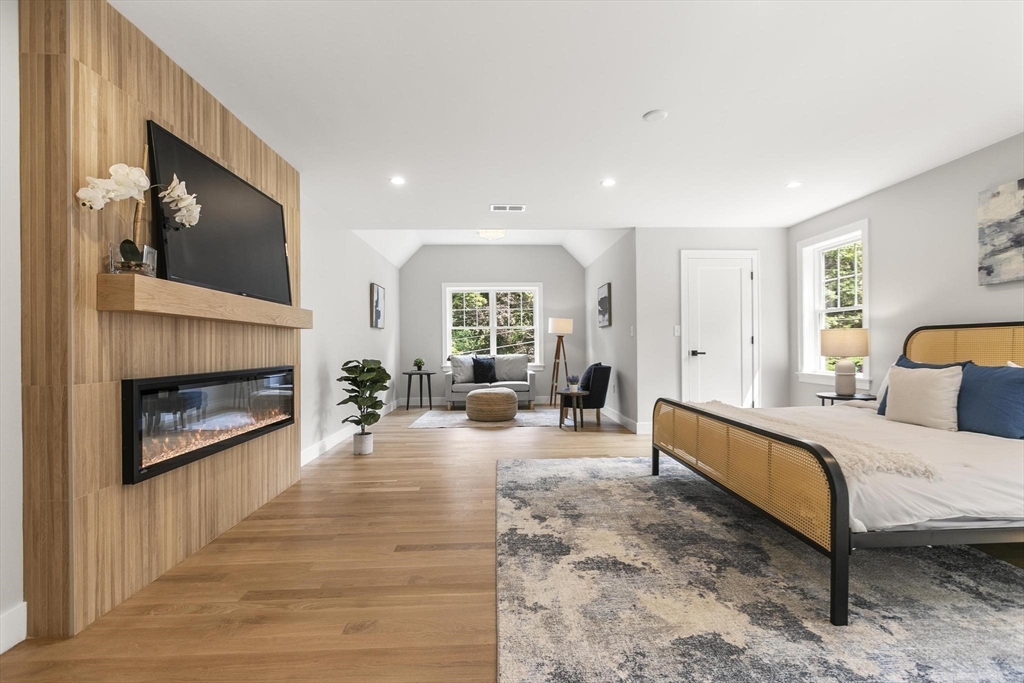 29 Beaverbrook Road Burlington, MA 01803 - Photo 20 of 42 a spacious bedroom with a bed and a fireplace