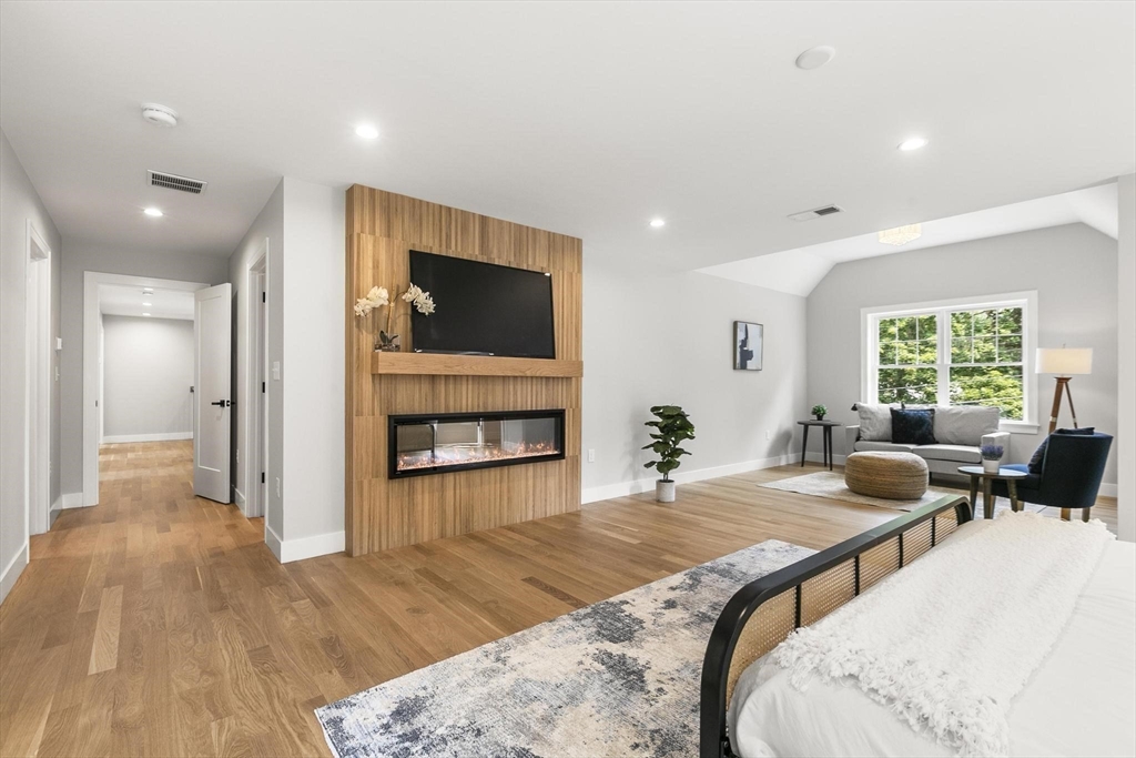 29 Beaverbrook Road Burlington, MA 01803 - Photo 21 of 42 a living room with fireplace furniture and a flat screen tv