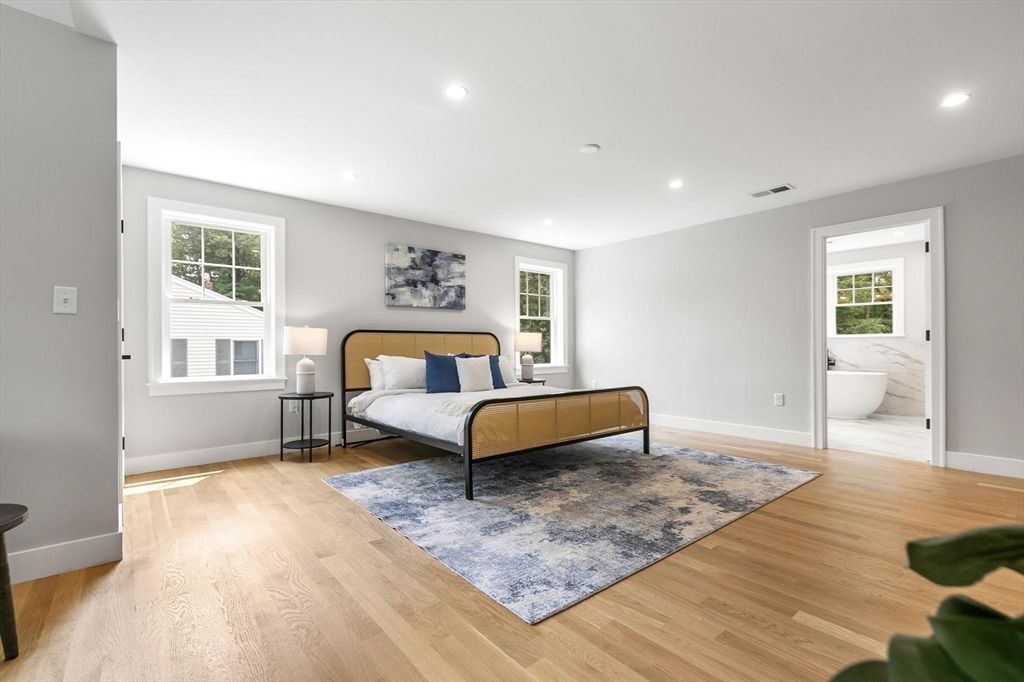 29 Beaverbrook Road Burlington, MA 01803 - Photo 22 of 42 a bedroom with a bed and wooden floor