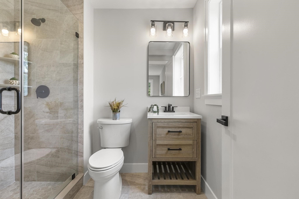 29 Beaverbrook Road Burlington, MA 01803 - Photo 29 of 42 a bathroom with a toilet sink and shower
