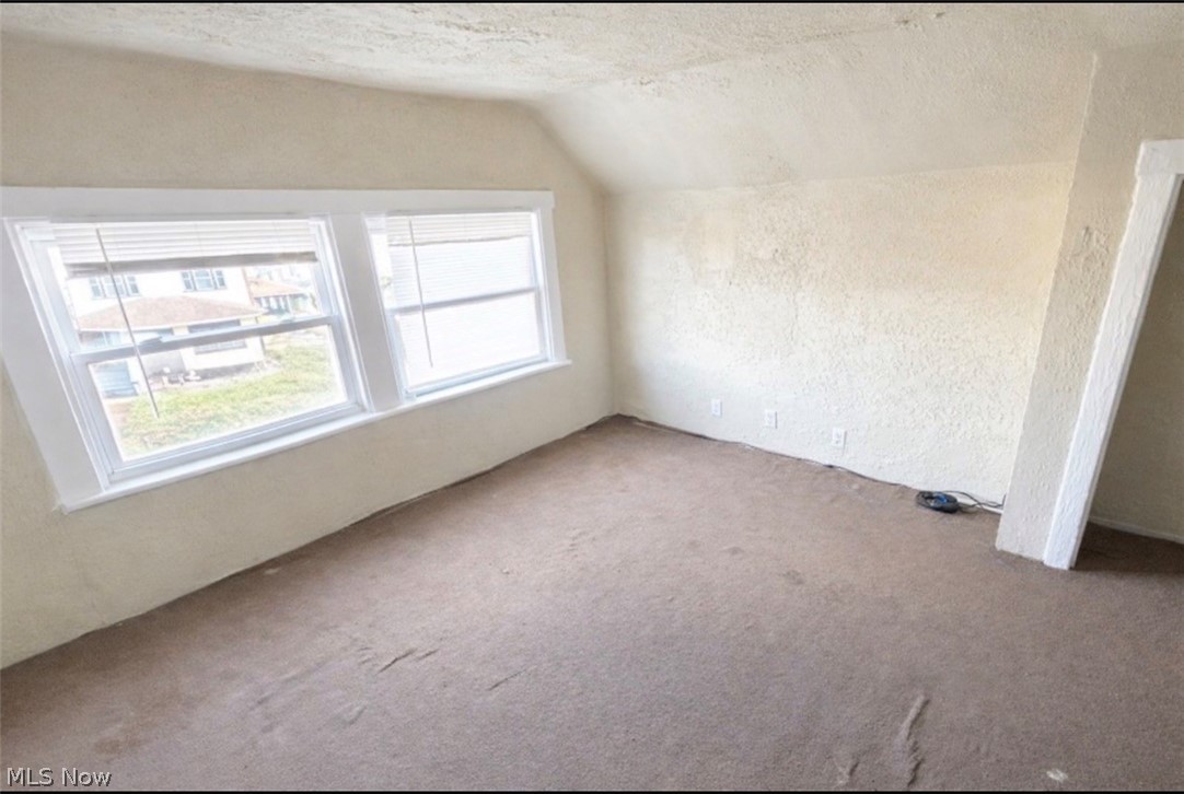 892 Paxton Road Cleveland, OH 44108 - Photo 11 of 15 Bonus room with a textured wall and carpet flooring