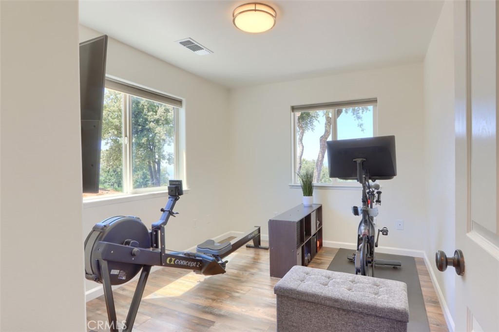 6097 Sherlock Road Midpines, CA 95345 - Photo 23 of 63 a view of a workspace with furniture and a window