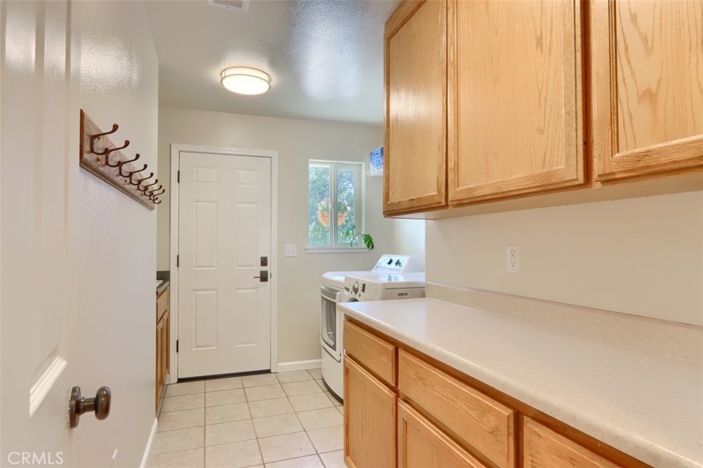 6097 Sherlock Road Midpines, CA 95345 - Photo 24 of 63 a kitchen with a sink and cabinets