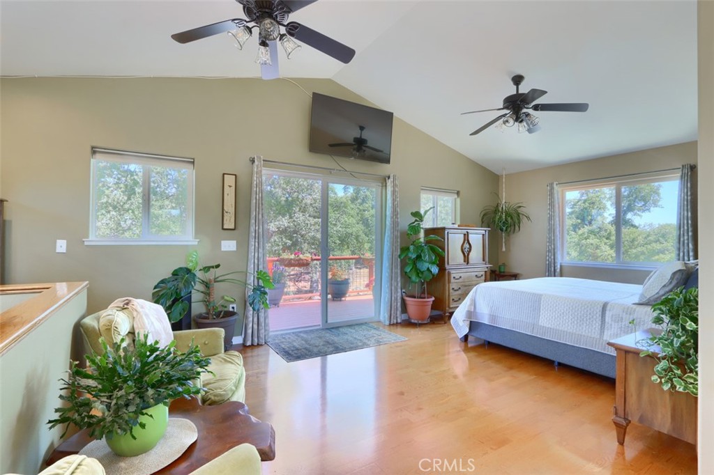 6097 Sherlock Road Midpines, CA 95345 - Photo 27 of 63 a living room with a balcony furniture and a flat screen tv