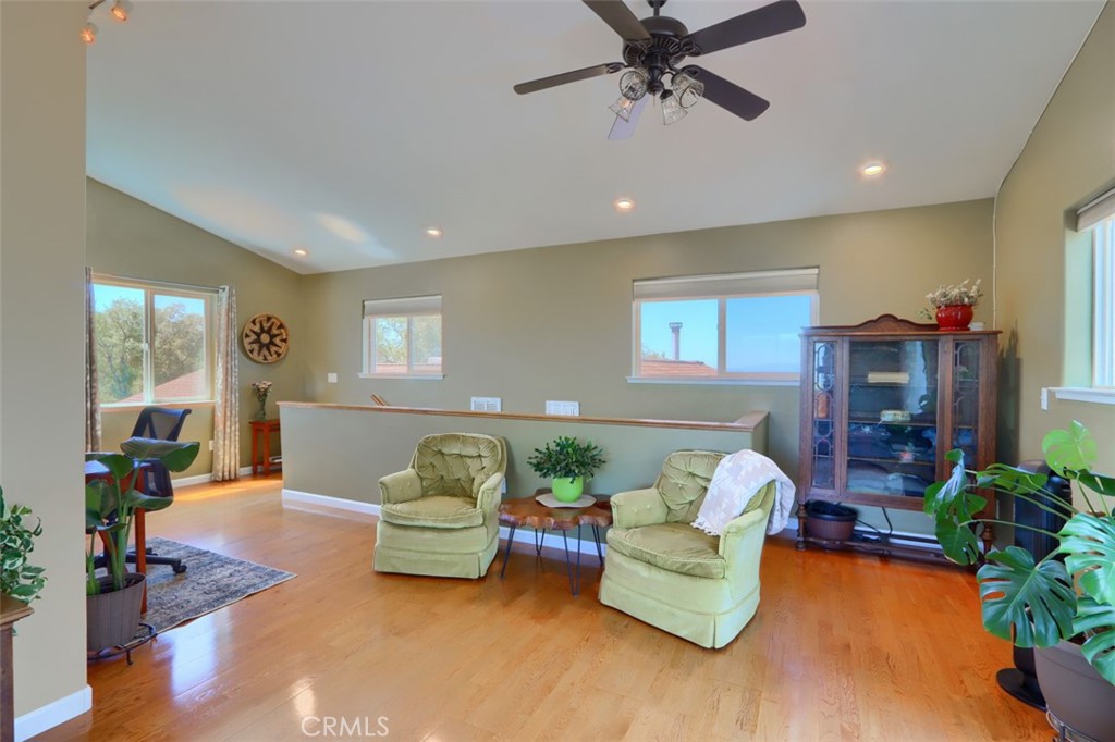 6097 Sherlock Road Midpines, CA 95345 - Photo 29 of 63 a living room with furniture and a wooden floor