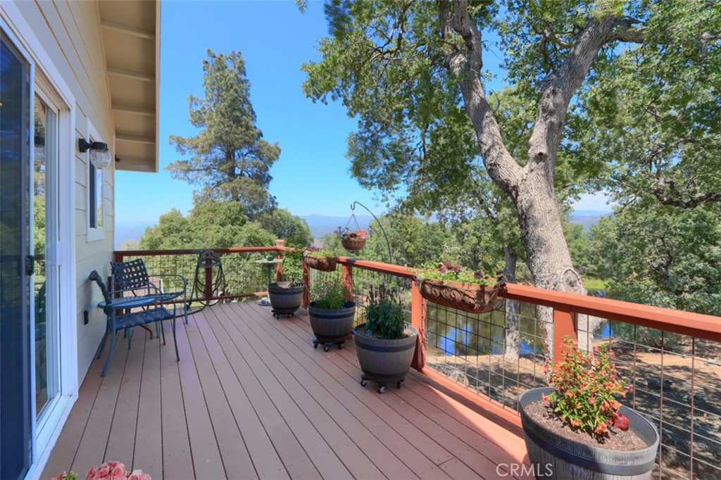6097 Sherlock Road Midpines, CA 95345 - Photo 33 of 63 a view of a balcony with wooden floor