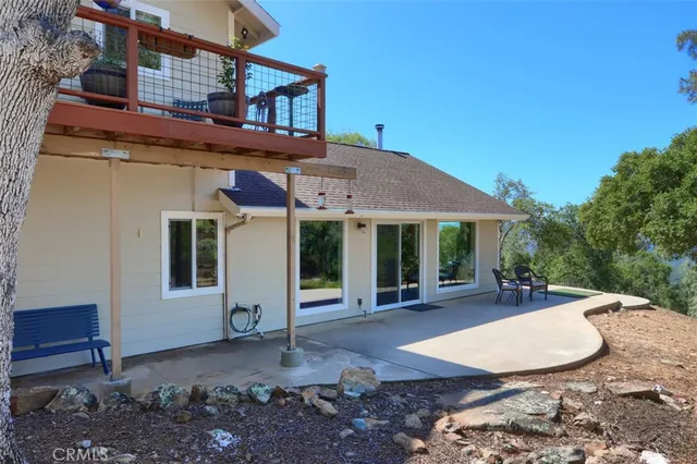 a view of a backyard with sitting area